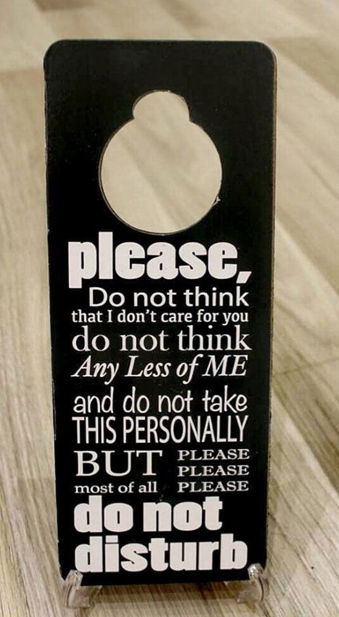 Please Do Not Disturb Sign Hanging On Door Handle